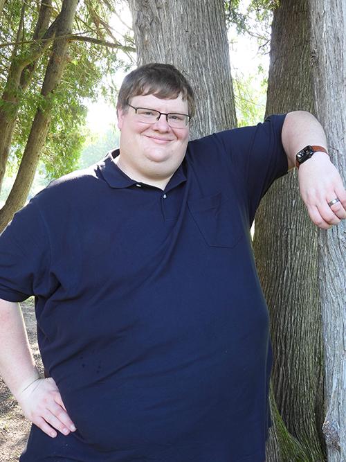 Jeff Forehand Thank You For Contacting Me - Jeff standing by a tree outside in a blue shirt